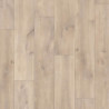 Suelo laminado Quick-Step Roble Havanna Natural con textura de cortes de sierra.