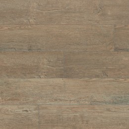 Suelo vinílico rígido en color Leta Oak con acabado efecto madera natural. Ideal para estancias cálidas y elegantes.