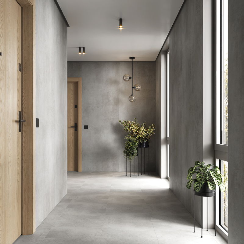 Acabado efecto hormigón con matices ahumados, ideal para ambientes contemporáneos.